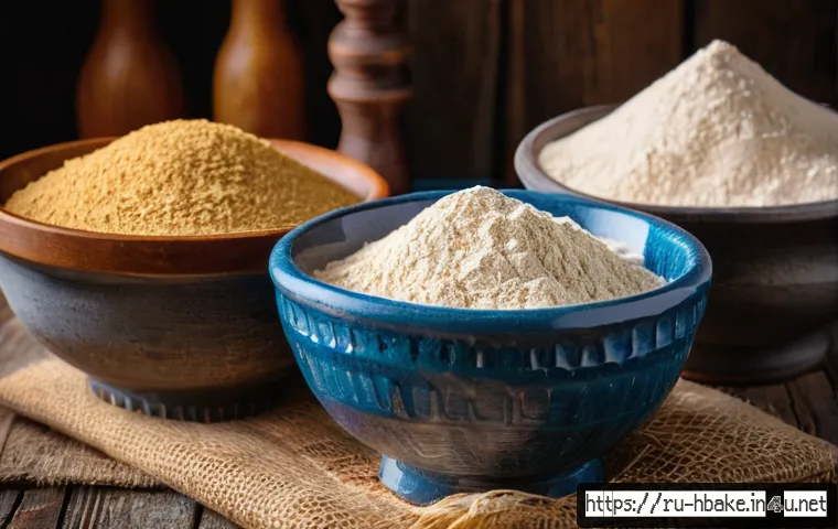 홈베이킹 빵 식감 차이 만드는 요소 - A detailed close-up of various types of wheat flour displayed in rustic ceramic bowls on a wooden ta...