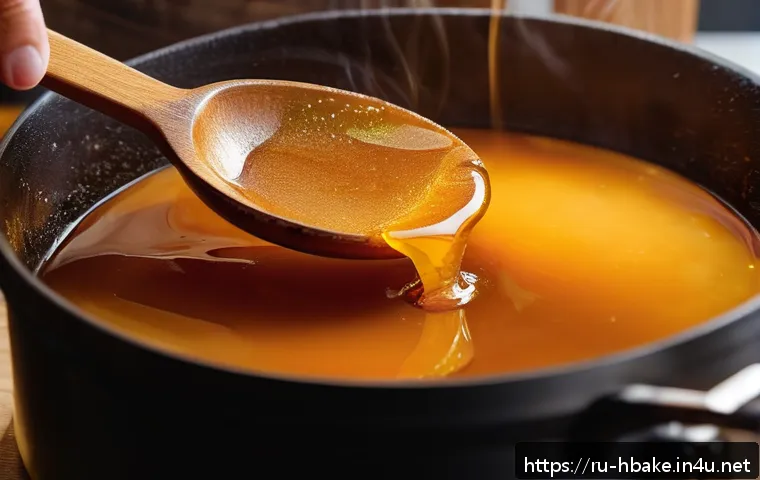 홈베이킹 달고나 만들기 - A close-up view of a traditional dalgona candy being caramelized in a thick-bottomed pot over medium...